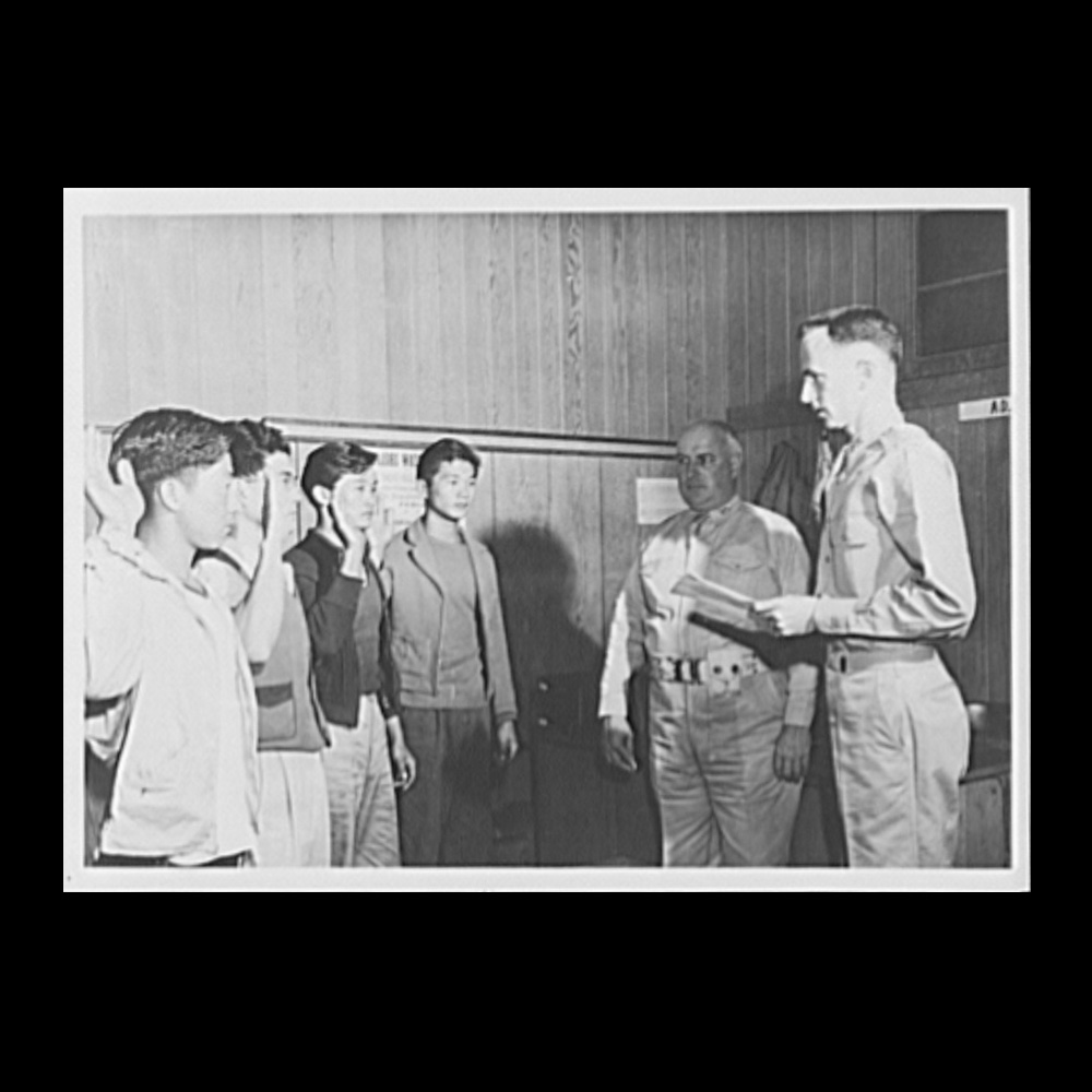 Photo of Japanese volunteers taking the oath of induction in 1943.